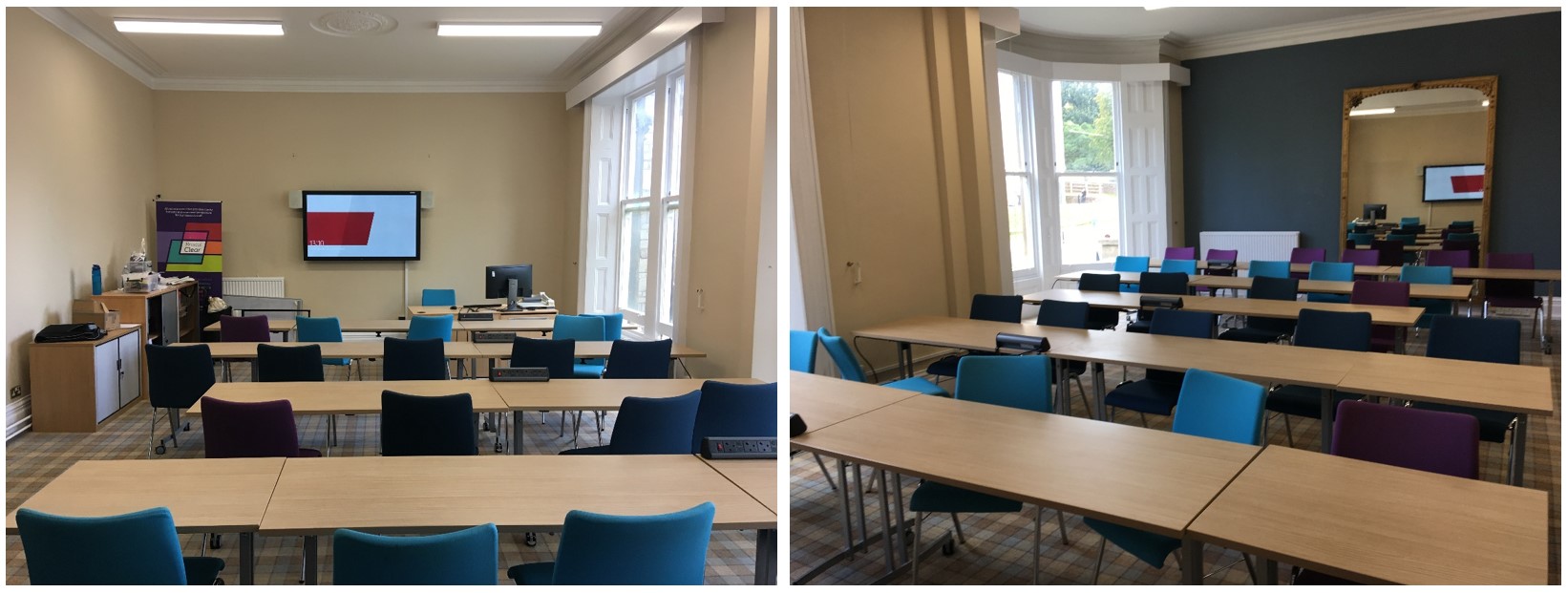 Tables and chairs in rows facing the teaching wall.